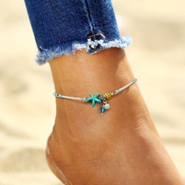Stjerne- og skjellanklet armbånd med naturlige steiner
